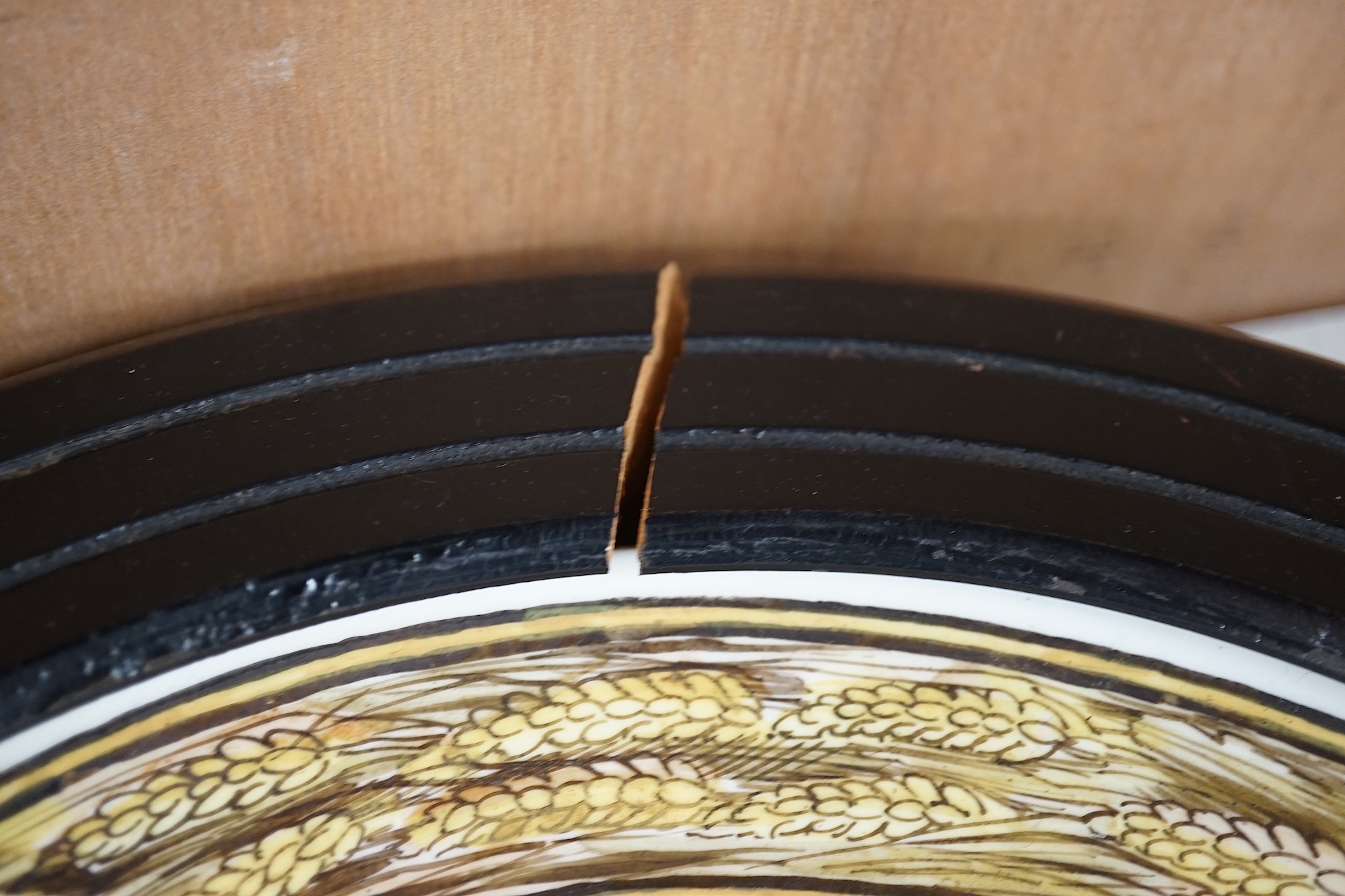 A set of four Copeland Spode Aesthetic period, outside decorated four seasons portrait plates, circa 1880, housed in ebonised wood frames, overall 31cm in diameter. Condition - fair, three frames cracked